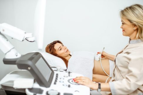 doctor-performs-ultrasound-examination-of-a-woman-e1700694825953